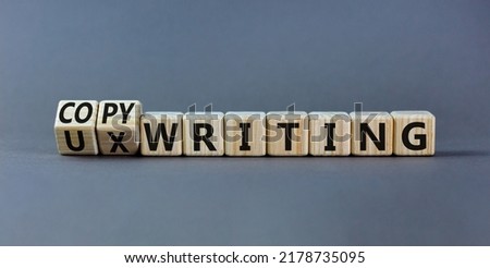 Copywriting or UX writing symbol. Turned cubes and changed concept words copywriting to UX writing. Beautiful grey background copy space. Business copywriting or UX writing user experience concept.