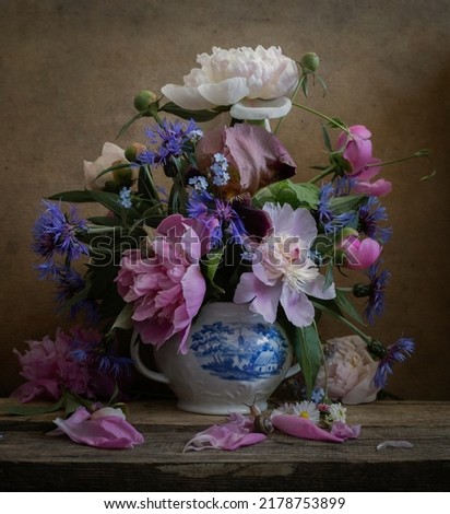 Still life with peonies . Fine art photo .  Peony flower  Royalty-Free Stock Photo #2178753899