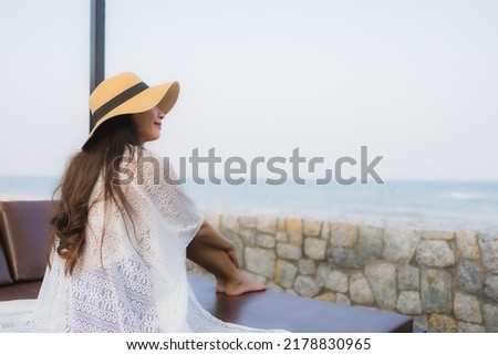 Portrait young asian woman happy smile relax around beach sea ocean for travel vacation