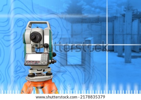 Geodetic equipment. Device for geodetic research. Optical theodolite in front of foundation of building. Art blue blurred. Geodetic device for cartography. Concept of provision of surveyor services Royalty-Free Stock Photo #2178835379
