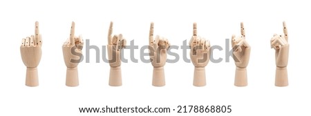 wooden hands of mannequins showing different gestures on white background.