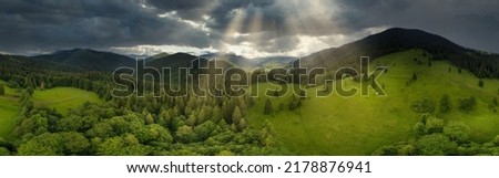 Wide-angle panoramic shot of beautiful meadows, hills and trees in Synevyrska glade next to Synevyr lake. Majestic and wonderful landscapes of the Carpathian mountains in Ukraine. High quality 4k 