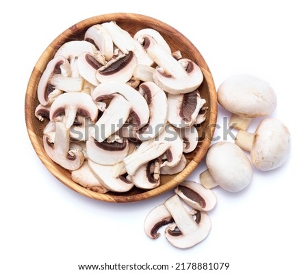 Fresh white champignon mushrooms in wooden bowl isolated on white background Royalty-Free Stock Photo #2178881079