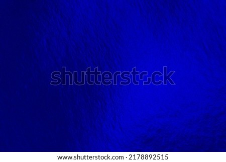 Blue foil background with uneven texture Royalty-Free Stock Photo #2178892515