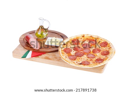 Italian pizza on the board with ingredients