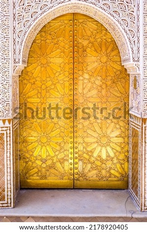 Old ornate golden door in the medina of Marrakesh, Morocco, North Africa Royalty-Free Stock Photo #2178920405