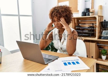 Young african american woman stressed working at office