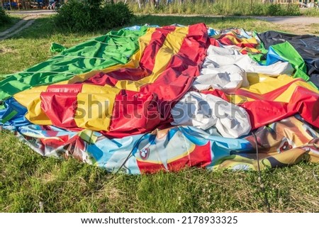 deflated children's trampoline on the grass