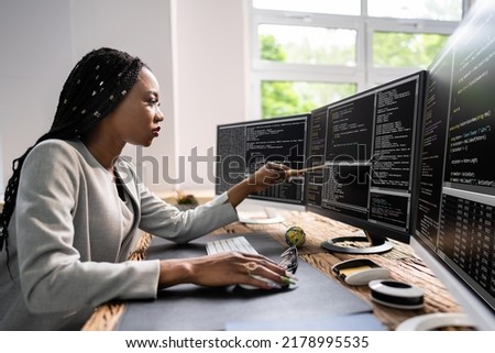 African American Coder Using Computer At Desk. Web Developer