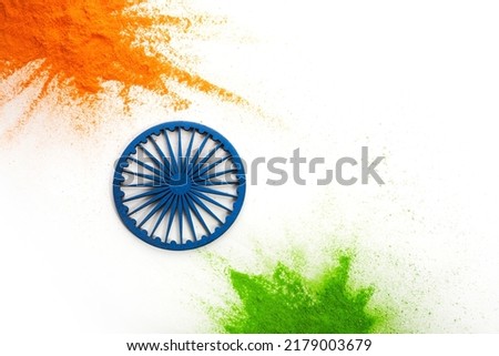 Orange and green color powder splash with Ashoka wheel. Concept for India independence day, 15th of august. Royalty-Free Stock Photo #2179003679