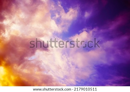   Yellow orange pink purple sunset. Beautiful evening sky with clouds. Background with space for design. Bright. Colorful. Fantastic.                             