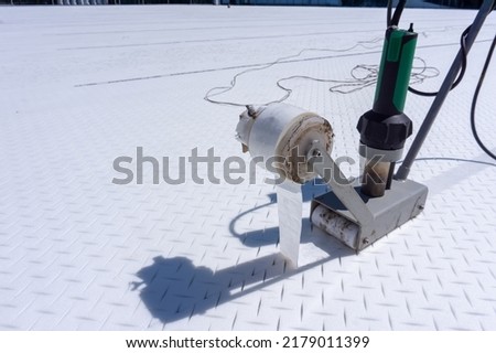 Tape machine for installation shock pad foam under artificial grass football field