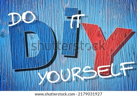 DIY Do-It-Yourself icon concept with letters against a wooden background - hobby and craft concept Royalty-Free Stock Photo #2179031927
