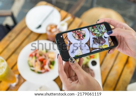 Take photo of the food in outdoor cafe