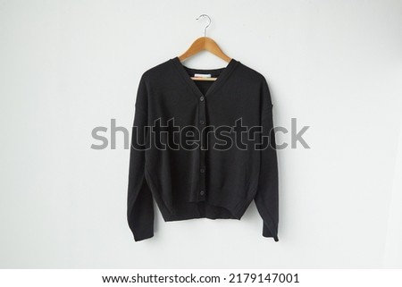 Black cardigan isolated on white background.V neck Royalty-Free Stock Photo #2179147001