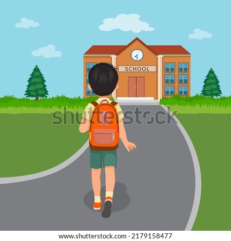 back view of cute little boy student with backpack walking going to school