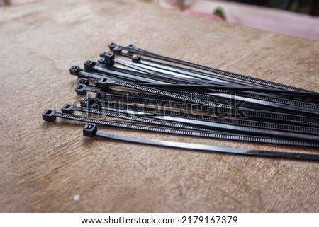 cable tie against the backdrop of a wooden table