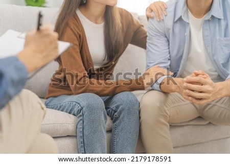 Psychology, depression asian young couple love, woman, man patient consulting problem mental health with psychologist, psychiatrist at clinic together, wife encouraging husband,  therapy health care.
