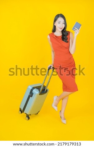 Portrait beautiful young asian woman with luggage bag and passport ready for travel