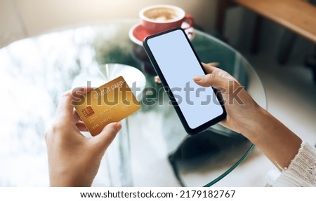 Close up view, young asian woman holding credit card and smart phone to shopping online and paying her order, People relax on holiday use technology from smart phone for the convenience of daily use Royalty-Free Stock Photo #2179182767
