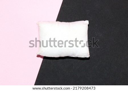 white pillow on black and pink background, pillow as copy space, creative art modern design happy lazy day, happy dream day