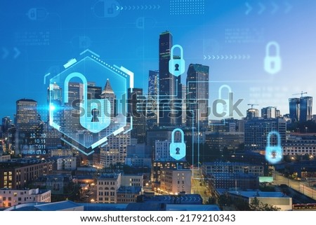 Illuminated aerial cityscape of Seattle, downtown at night time, Washington, USA. The concept of cyber security to protect confidential information, padlock hologram