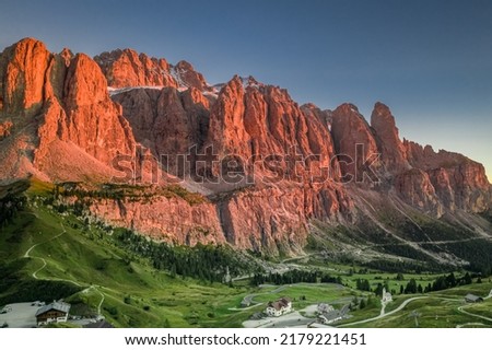 Passo Gardena in Dolomites at red sunset, Italy, Europe Royalty-Free Stock Photo #2179221451