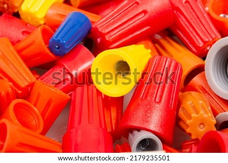 Many colored wire nuts on white background , Tool for connecting electrical wires.