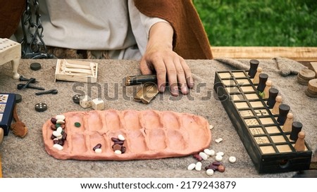Senet and kalah game, popular in ancient Roman. Reconstruction of board games from the Roman Empire Royalty-Free Stock Photo #2179243879