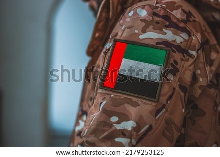 United Arab Emirates Soldier. Soldier with flag United Arab Emirates, United Arab Emirates flag on a military uniform. Camouflage clothing