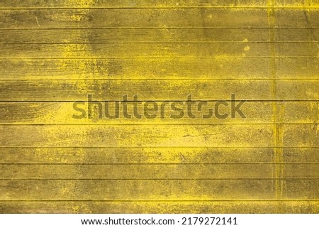 Yellow coloured wooden scratched background. Natural background, High resolution picture.