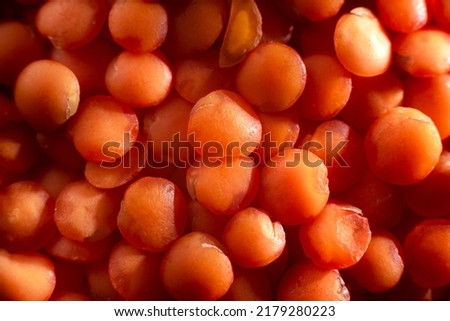 Dry red lentils very close. Red lentil grits. Dried orange lentil grains, pile of daal, raw daal, dhal, masur, Lens culinaris or Lens esculenta