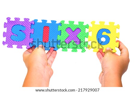 child playing alphabet puzzle