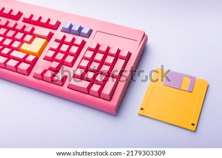 Floppy disks and keyboard on bright colored backgrounds. High quality photo
