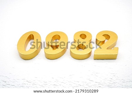  Number 0982 is made of gold painted teak, 1 cm thick, laid on a white painted aerated brick floor, visualized in 3D.                                         