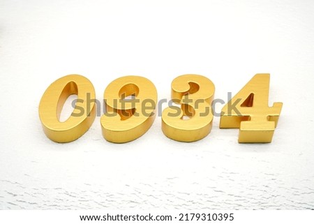     Number 0934 is made of gold painted teak, 1 cm thick, laid on a white painted aerated brick floor, visualized in 3D.                              