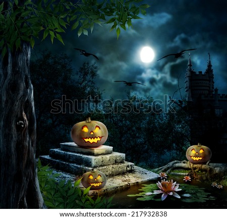 Halloween pumpkins in yard of old house night in bright moonlight 