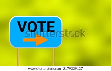 vote here sigh board isolated on green blur background.