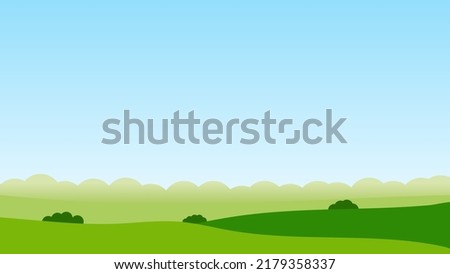 green field and blue sky landscape scene
