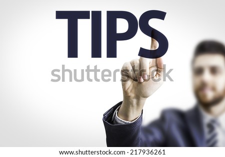 Business man pointing to transparent board with text: Tips