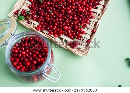 autumn berries on table, lingonberry raw closeup Royalty-Free Stock Photo #2179362853