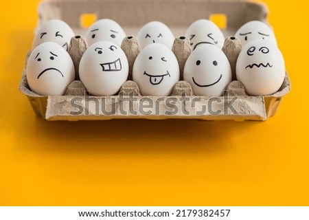 Set funny eggs on yellow background. The main symbol of the Happy Easter holiday. Easter eggs funny characters for greeting card banner poster.