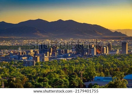 Salt Lake City skyline at sunset with Wasatch Mountains in the background, Utah, USA. Royalty-Free Stock Photo #2179401755