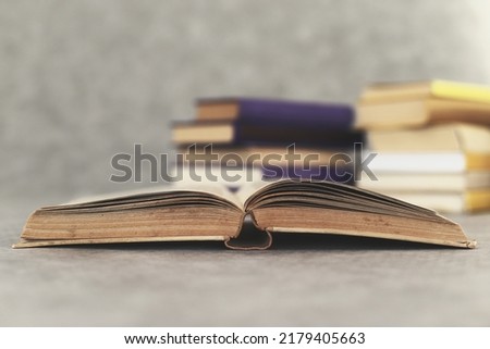 a novel by a famous writer open for reading on the table Royalty-Free Stock Photo #2179405663