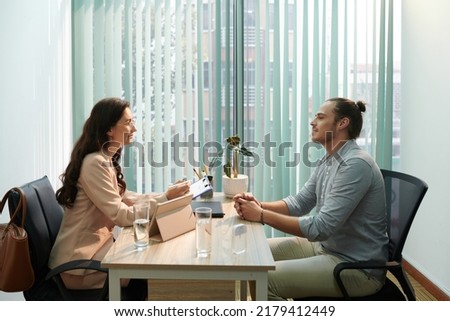 Human Resources manager talking to job candidate, discussing his skills and expected salary Royalty-Free Stock Photo #2179412449