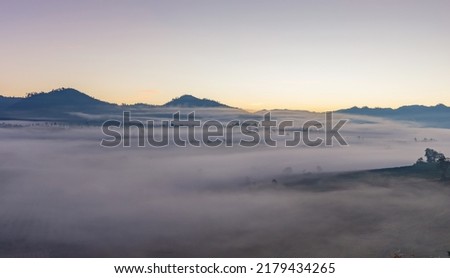 Heaven at early sunrise predawn clear sky over the mountains with the morning mist. Panorama