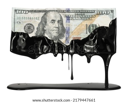 US American dollar bill dripping with crude oil showing the high cost of gas at the pump or the USA dependency on fossil fuels. Royalty-Free Stock Photo #2179447661