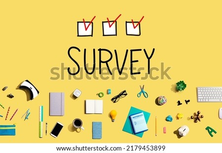 Survey with collection of electronic gadgets and office supplies