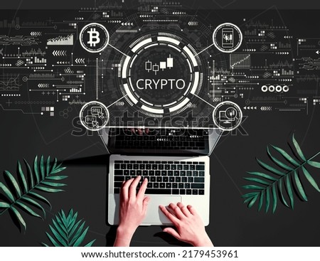 Crypto Trading theme with person using a laptop computer