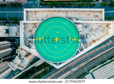 A helipad on the roof of a high-rise building